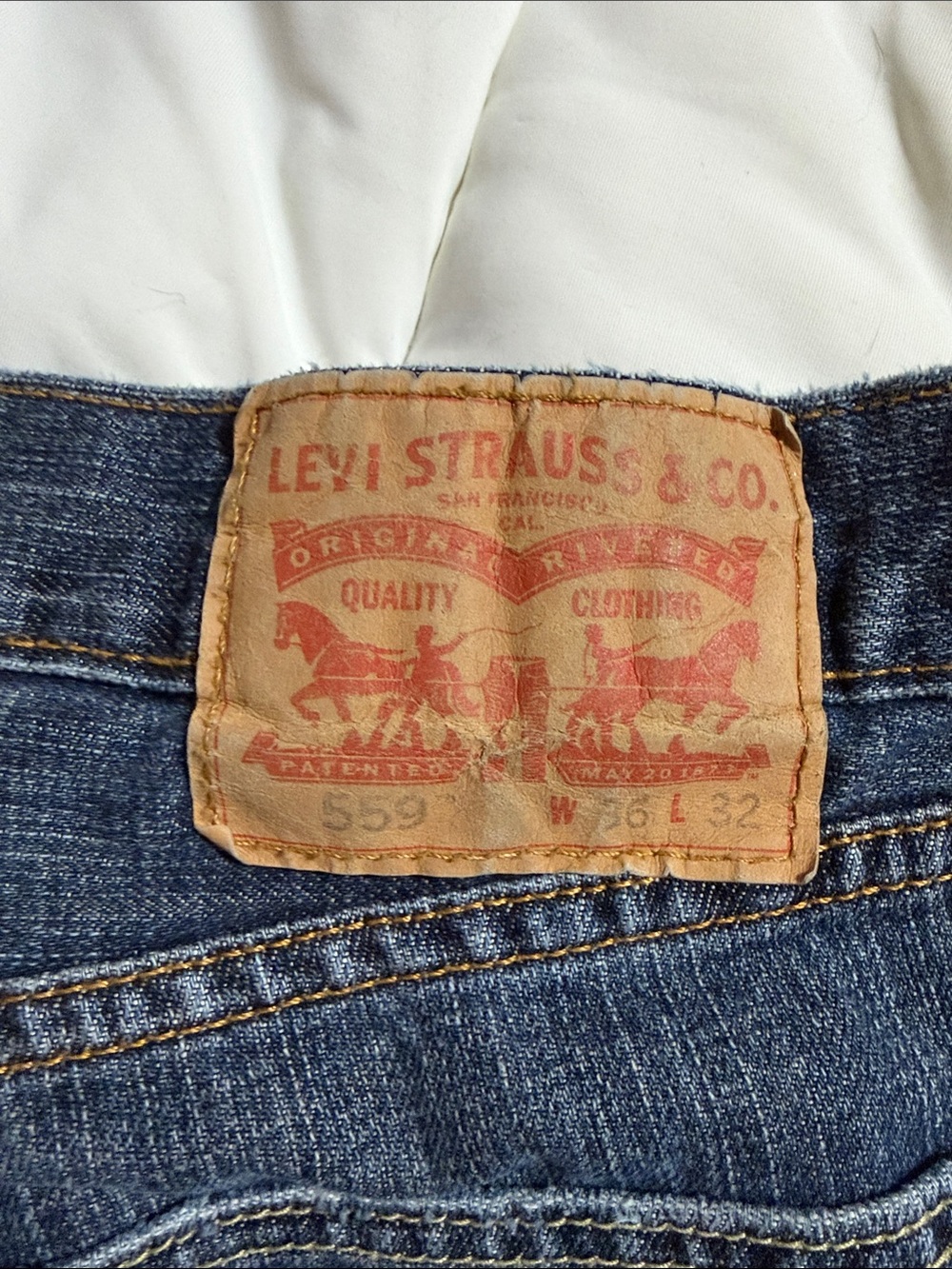 Levi's Men's Straight Jeans in Dark Blue Denim with Leather Patch